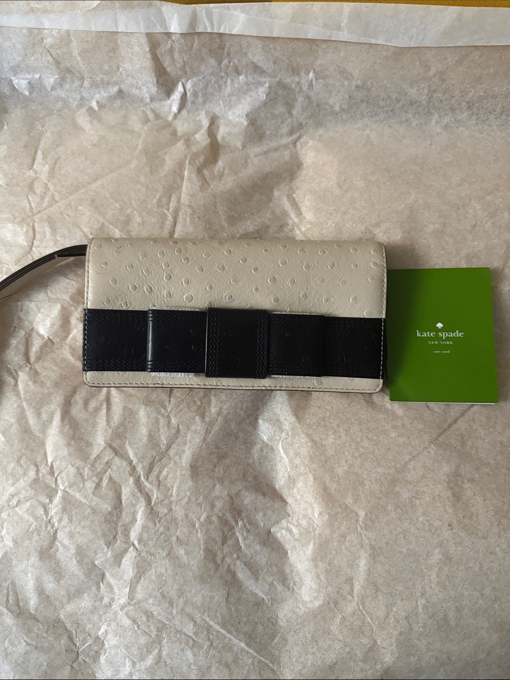 kate spade cream and black bow wristlet clutch